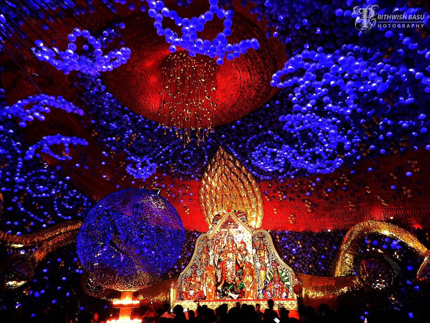 Illuminated Durga Puja pandal decorations at Kashi Bose Lane in Kolkata at night
